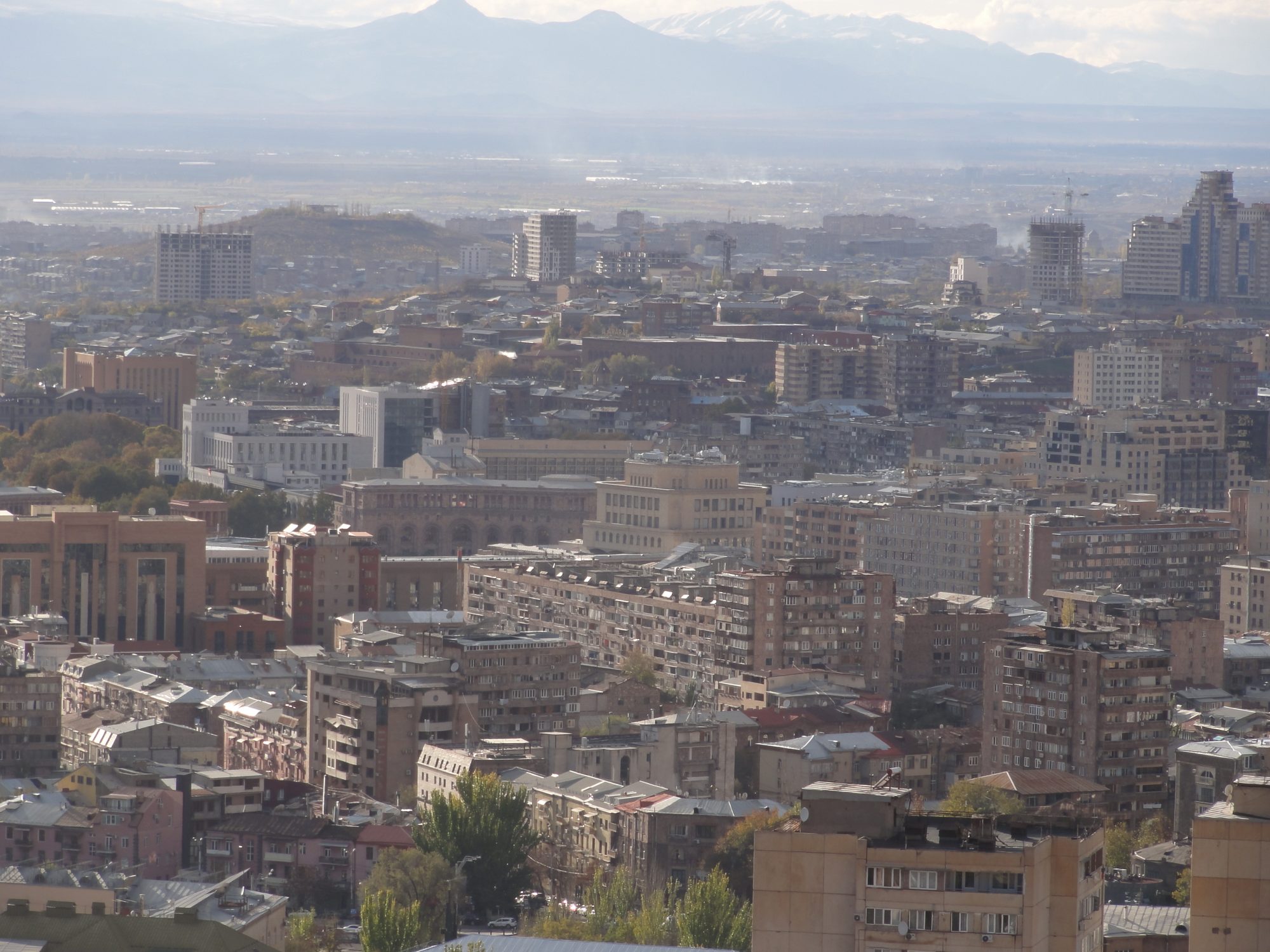 Central Yerevan under haze, seen from Nork-Marash, with the Ararat plain and mountains behind
