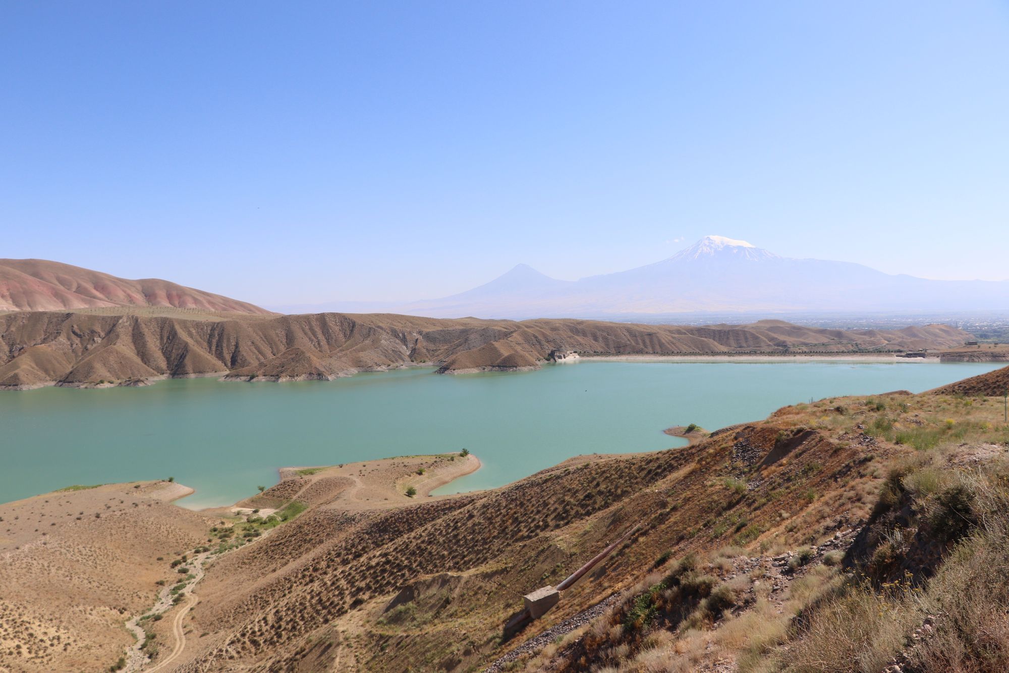 Azat reservoir among dry hills, Mount Ararat in the distance