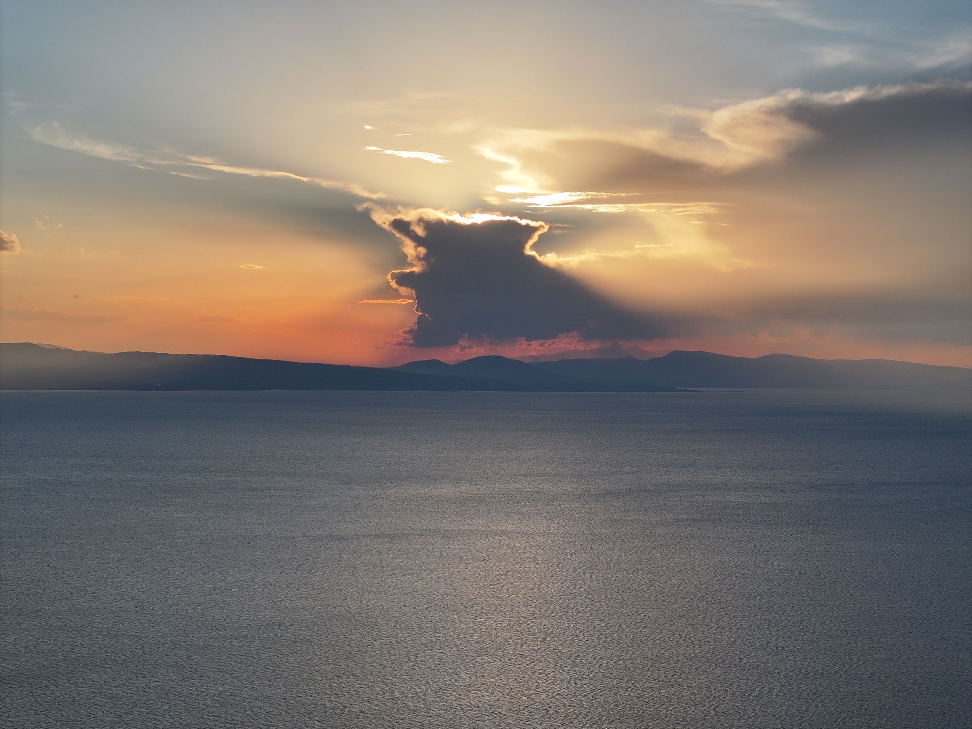 Sunset over Lake Sevan with a dark cloud